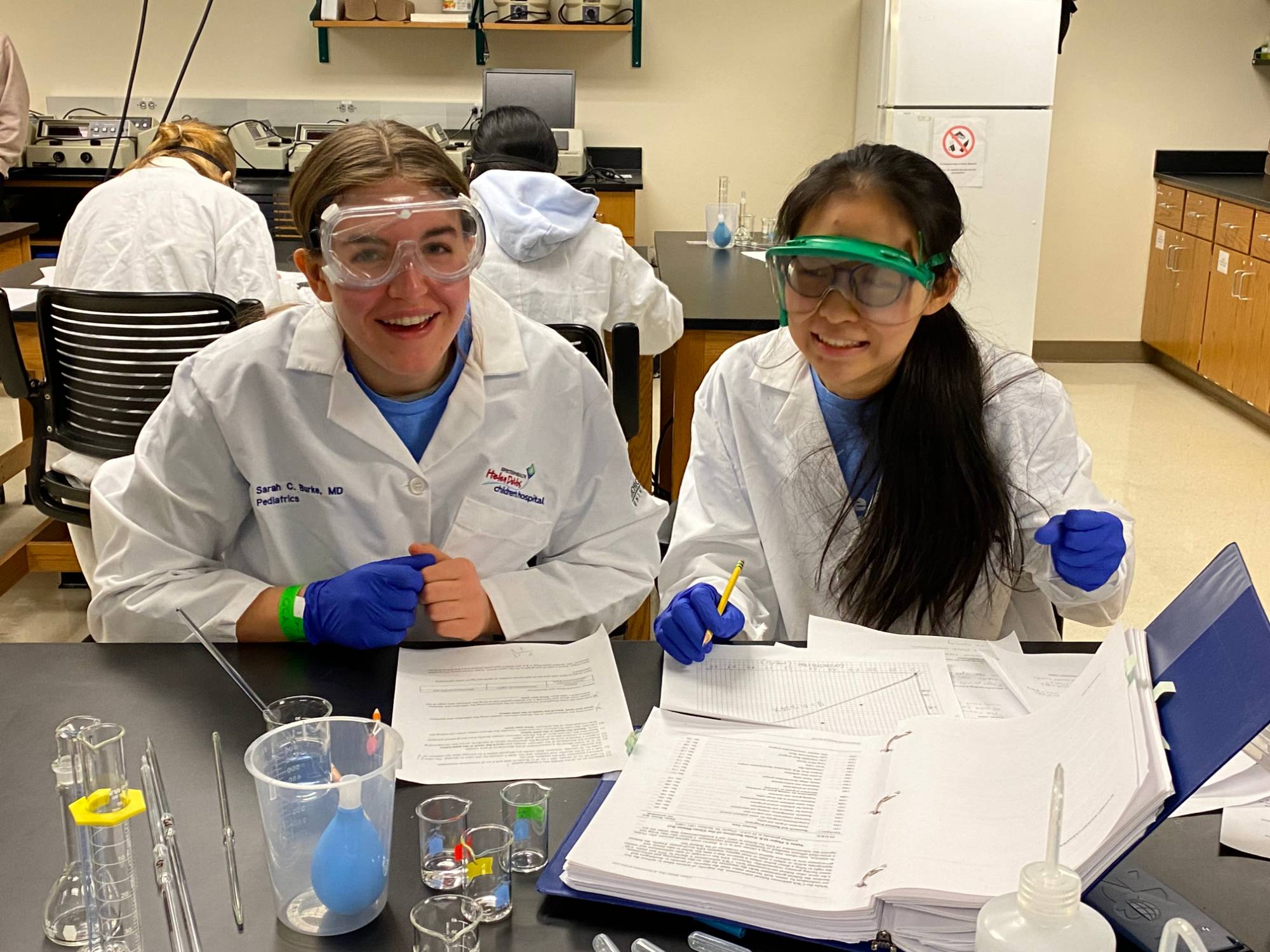 Girls competing in chemistry lab